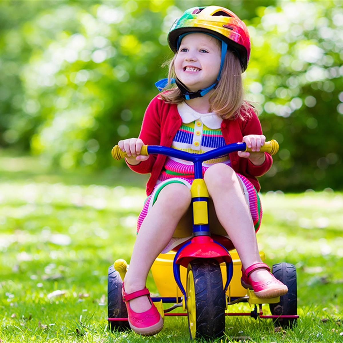 kid riding tricycle